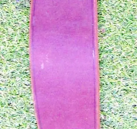 Wide leather strap on grass