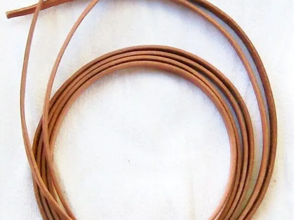 Brown leather strings neatly coiled