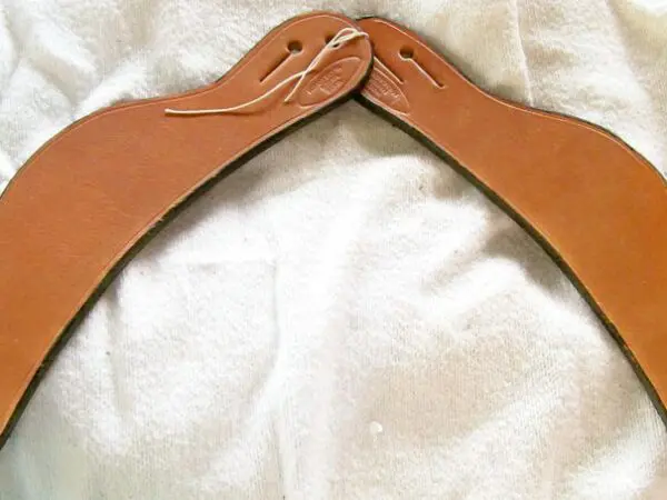 Handmade leather boomerang displayed flat
