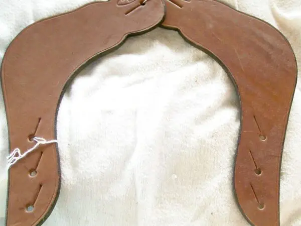 Brown leather saddle pieces displayed