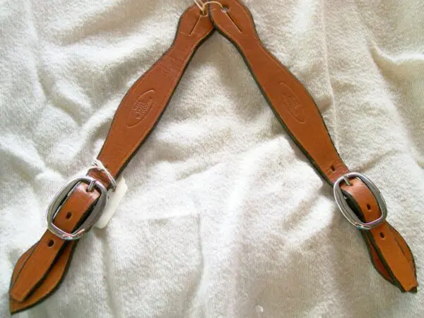 Brown leather straps on display