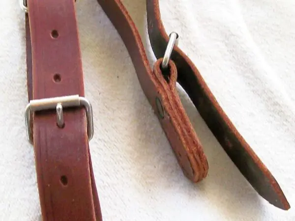 Brown leather straps with metal buckles