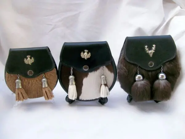 Three traditional Scottish sporrans displayed