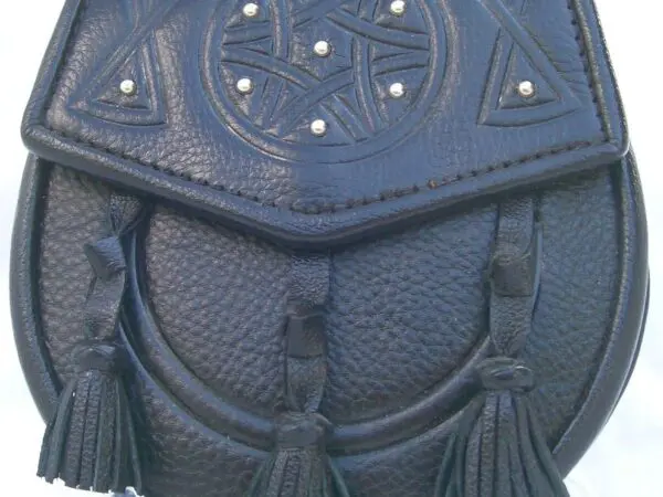 Black leather bag with tassels