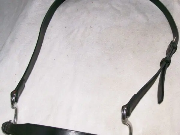 Leather horse bridle on white cloth