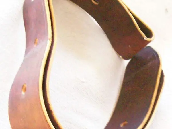 Curved leather belt with holes