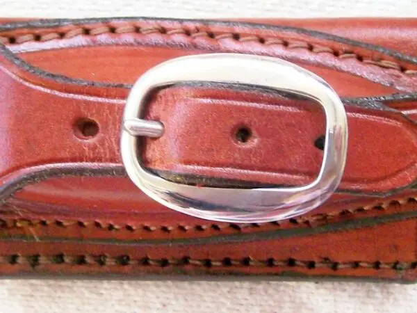 Brown leather belt with silver buckle