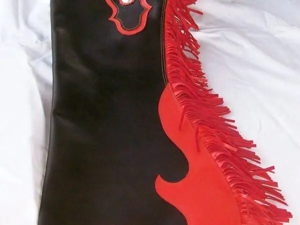 Decorative leather chaps on white fabric