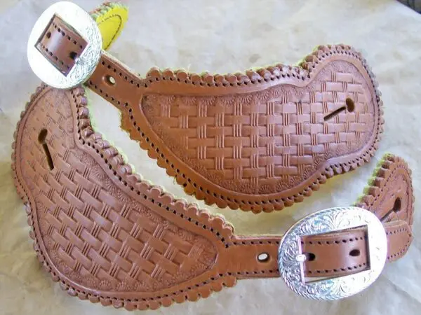 Embossed leather straps with silver buckles