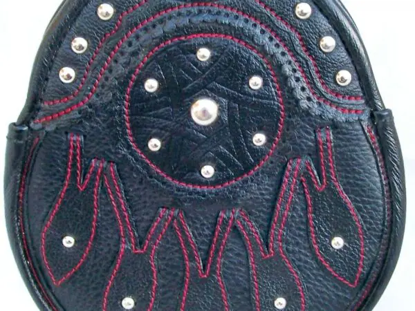 Leather sporran with red stitching and studs