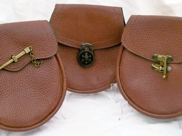 Three brown pouches on white background