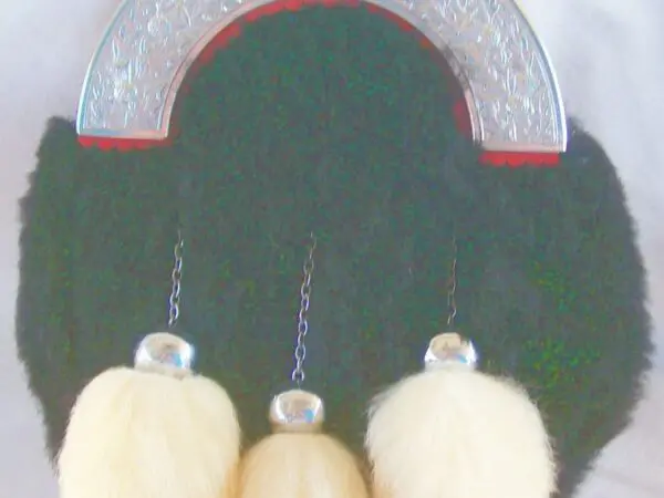 Ornate sporran featuring three tassels