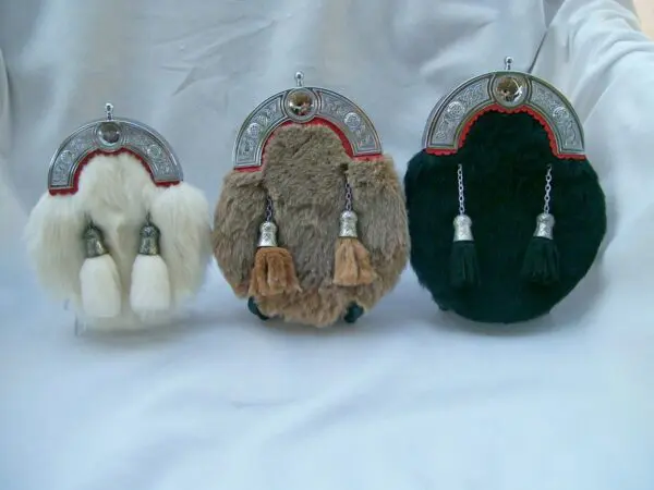 Three ornate sporrans with tassels