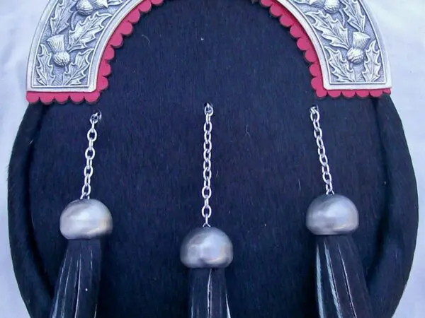 Black sporran with silver tassels