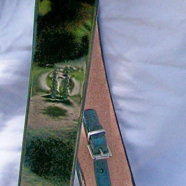 Glossy leather belt lying on cloth