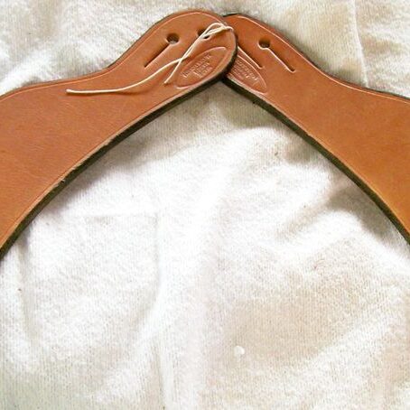 Handmade leather boomerang displayed flat