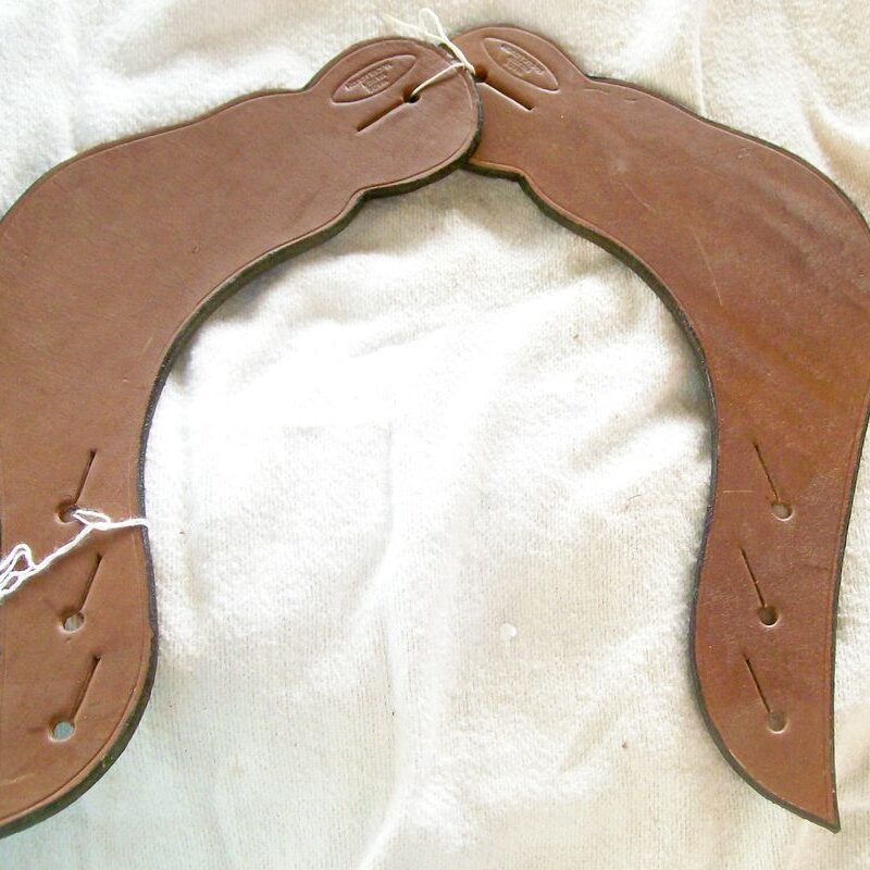 Brown leather saddle pieces displayed