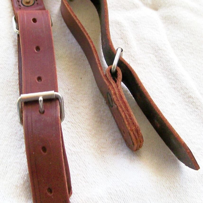 Brown leather straps with metal buckles