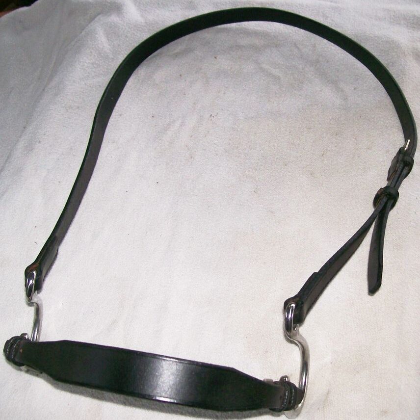 Leather horse bridle on white cloth