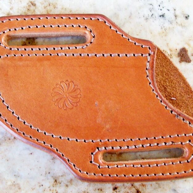 Handcrafted leather belt accessory with stitching