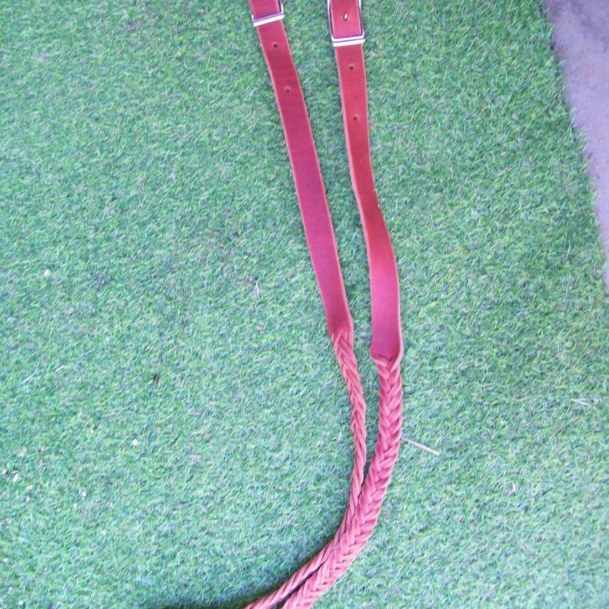 Leather straps on green grass