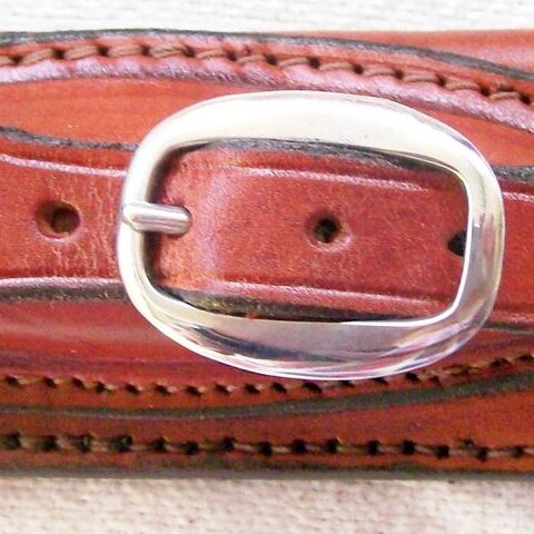 Brown leather belt with silver buckle