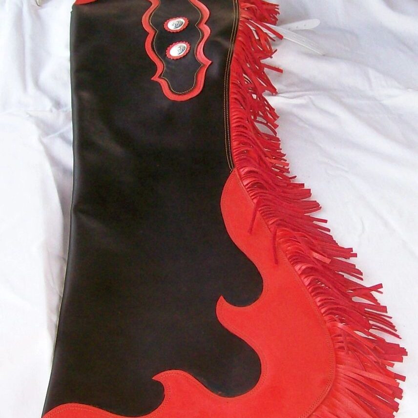 Decorative leather chaps on white fabric