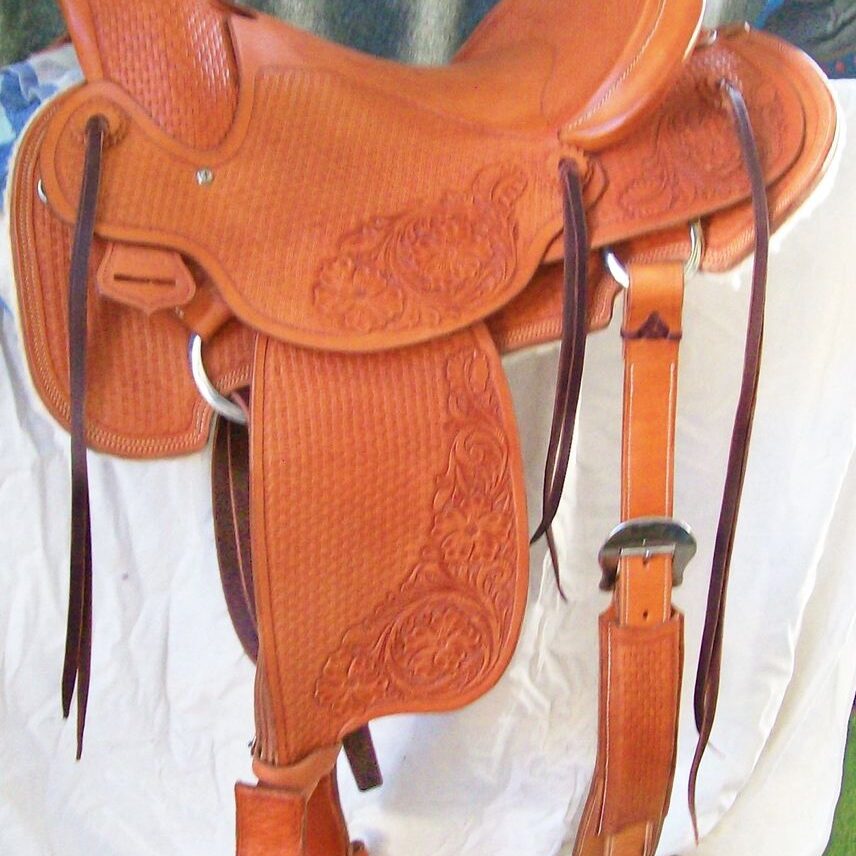 Ornate leather saddle with intricate patterns
