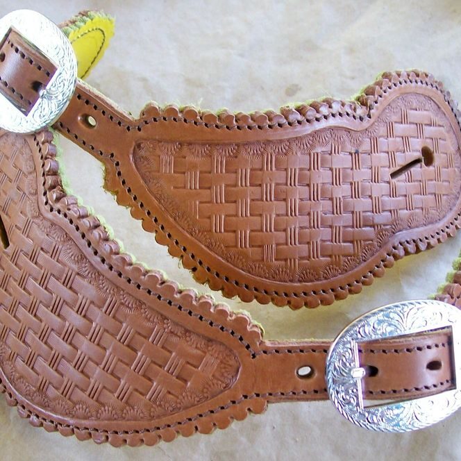 Embossed leather straps with silver buckles