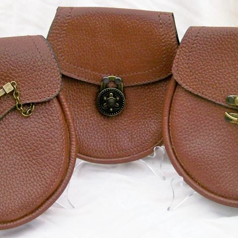 Three brown pouches on white background
