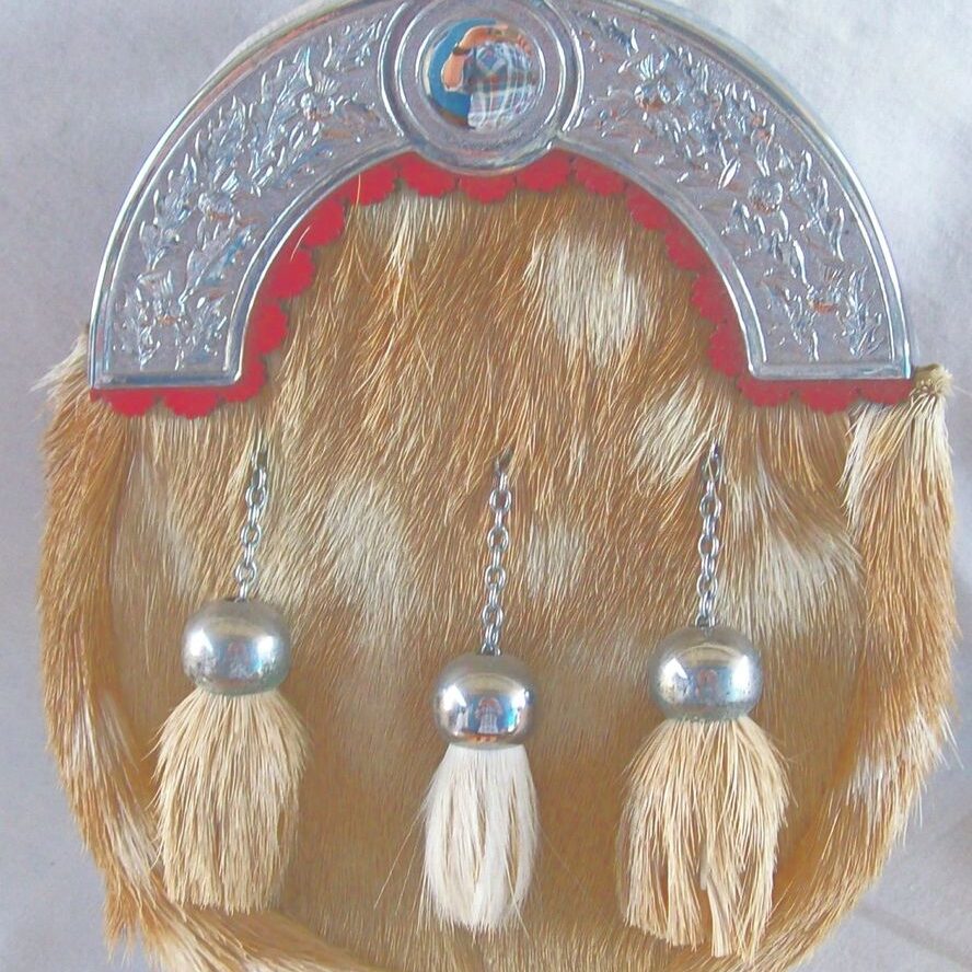 Decorative sporran featuring fur and metal