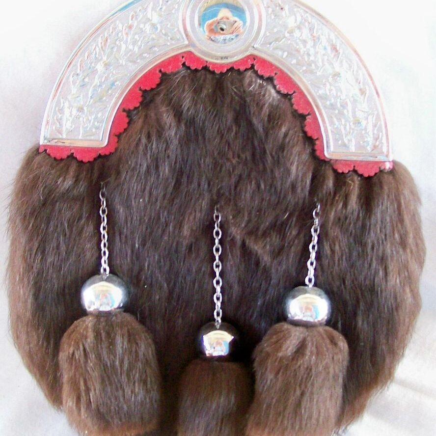 Decorative fur piece with hanging ornaments