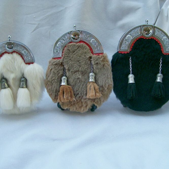 Three ornate sporrans with tassels
