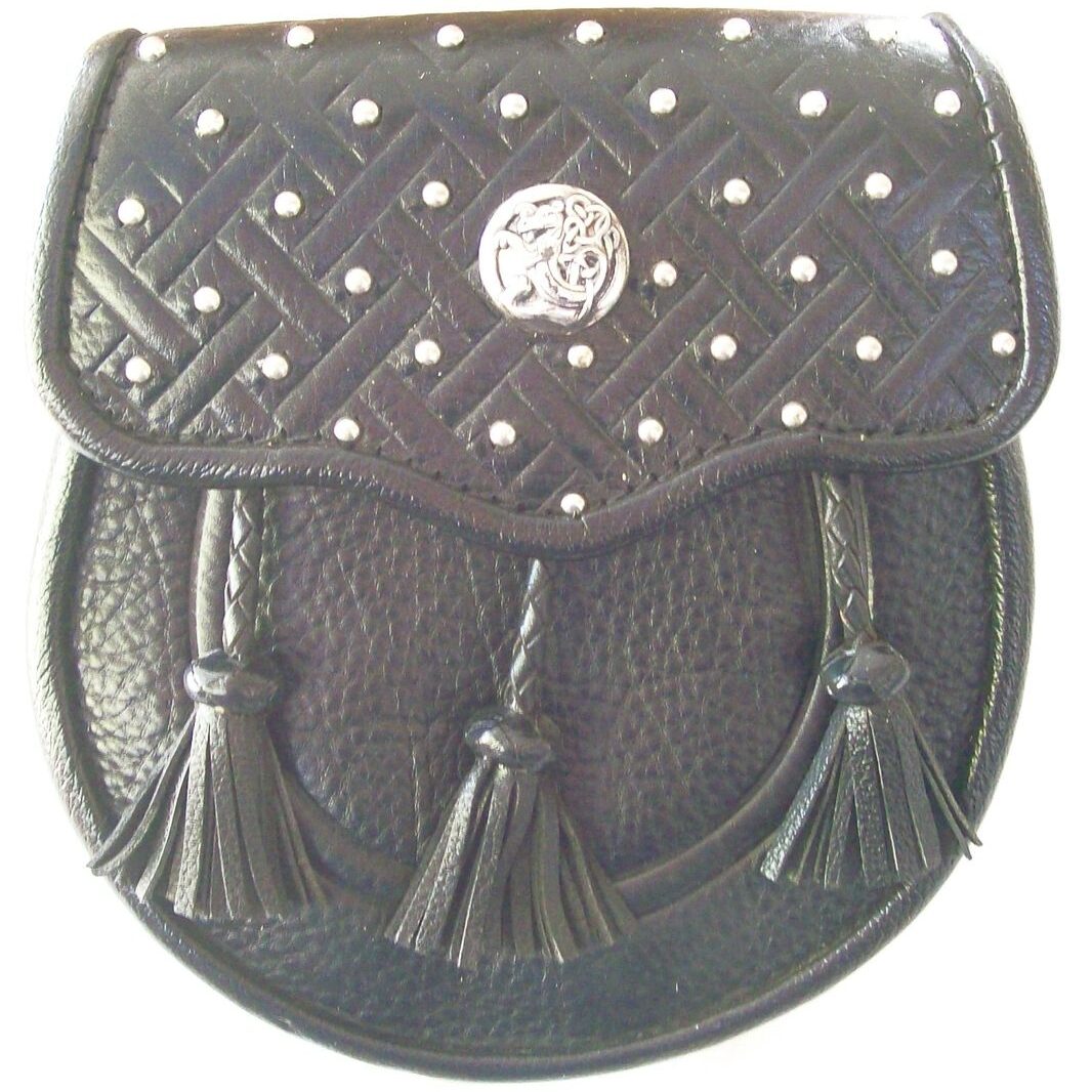 Traditional Scottish sporran with tassel accents